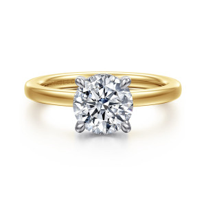 Gabriel & Co. ER16860R6M44JJ 14 karat white and yellow gold Classic engagement ring, front view of a round center held by four prongs above a smooth rounded band