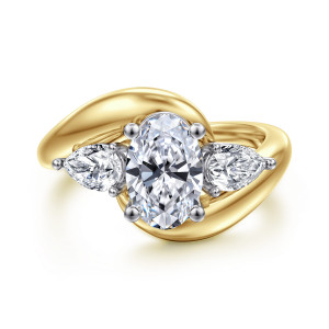 Gabriel & Co. ER16892O6M44JJ 14 karat white and yellow gold Contemporary engagement ring, front view of an oval center between pear shaped side stones on a bypass band