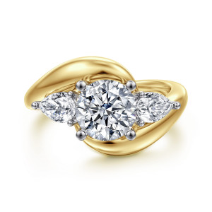 Gabriel & Co. ER16892R6M44JJ 14 karat white and yellow gold Contemporary engagement ring, front view of a round center between two outward pointing pear shaped stones on a bypass band