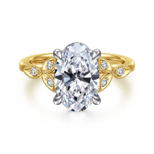 Gabriel & Co. ER16895O12M44JJ 14 karat white and yellow gold Victorian engagement ring, front view of an oval center with four claw prongs between clusters of beaded leaf motifs