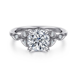Gabriel & Co. ER16895R6W44JJ 14 karat white gold Victorian engagement ring, front view of leaf frames with milgrain edges, each holding a small diamond, beside the round center