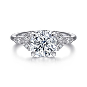 Gabriel & Co. ER16895R8W44JJ 14 karat white gold Victorian engagement ring, front view of a round center with beaded leaf frames meeting in a V beside the head