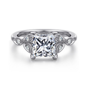 Gabriel & Co. ER16895S6W44JJ 14 karat white gold Victorian engagement ring, front view of a princess cut center with squared corner prongs between beaded leaf frames