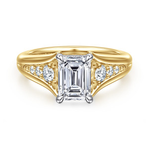 Gabriel & Co. ER16896E6M44JJ 14 karat white and yellow gold Contemporary engagement ring, front view of an emerald cut center with corner prongs and a split band holding round diamonds