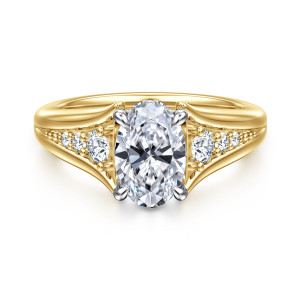 Gabriel & Co. ER16896O6M44JJ 14 karat white and yellow gold Contemporary engagement ring, front view of an oval center in four claw prongs with the shank splitting on both sides