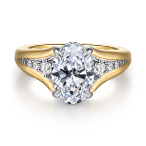Gabriel & Co. ER16896O8M44JJ 14 karat white and yellow gold Contemporary engagement ring, front view of an oval center in four prongs with shoulders parting into two arms
