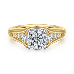 Gabriel & Co. ER16896R6M44JJ 14 karat white and yellow gold Contemporary engagement ring, front view of a round center flanked by graduated round diamonds on a shank that opens wide