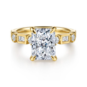 Gabriel & Co. ER16897N12Y44JJ 14 karat yellow gold Contemporary engagement ring, front view of a radiant cut center with boxed baguettes and round diamonds along the shoulders