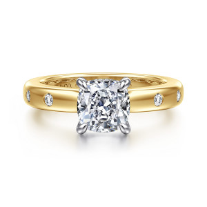 Gabriel & Co. ER16898C6M44JJ 14 karat white and yellow gold Contemporary engagement ring, front view of a cushion center with teardrop shaped prongs and flush set round stones