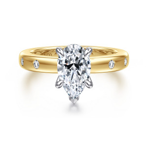 Gabriel & Co. ER16898P6M44JJ 14 karat white and yellow gold Contemporary engagement ring, front view of a pear shaped center with round bezel set diamonds spaced along each shoulder