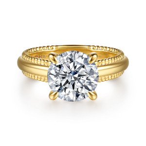 Gabriel & Co. ER16899R12Y4JJJ 14 karat yellow gold Bujukan engagement ring, front view of a round center in four prongs above a domed band edged with tiny beads