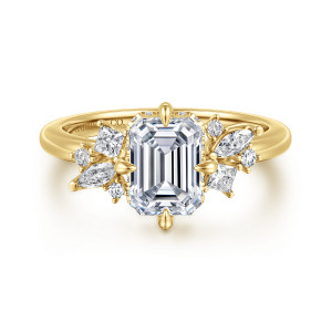 Gabriel & Co. ER16901E6Y44JJ 14 karat yellow gold Starlight engagement ring, front view of an emerald cut center with teardrop tipped prongs and a stone cluster on each side