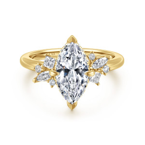 Gabriel & Co. ER16901M6Y44JJ 14 karat yellow gold Starlight engagement ring, front view of a marquise center between two sprays of mixed shape small diamonds