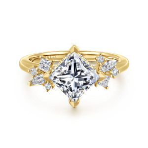 Gabriel & Co. ER16901S6Y44JJ 14 karat yellow gold Starlight engagement ring, front view of a princess cut center on its point flanked by shoulder clusters
