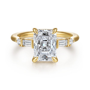 Gabriel & Co. ER16907N10Y44JJ 14 karat yellow gold Contemporary engagement ring, front view of a clipped corner rectangular center with a baguette diamond on each side