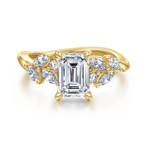 Gabriel & Co. ER16910E6Y44JJ 14 karat yellow gold Floral Nouveau engagement ring, front view of the emerald cut center with corner prongs and leaf like clusters on each shoulder