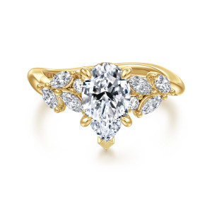 Gabriel & Co. ER16910P6Y44JJ 14 karat yellow gold Floral Nouveau engagement ring, front view of a pear shaped center with a V tip prong between leaf like stone clusters