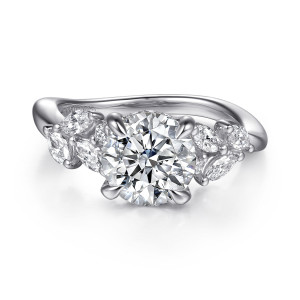 Gabriel & Co. ER16910R8W44JJ 14 karat white gold Floral Nouveau engagement ring, front view of a round center with hidden stones below it and leaf like clusters on both shoulders