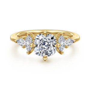 Gabriel & Co. ER16911C6Y44JJ 14 karat yellow gold Contemporary engagement ring, front view of a cushion center flanked by elongated stones in curled petal like holders