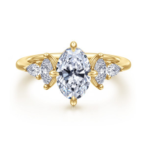 Gabriel & Co. ER16911O6Y44JJ 14 karat yellow gold Contemporary engagement ring, front view of the oval center with pointed side stones stepping down on either side