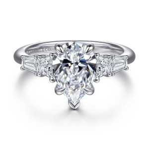 Gabriel & Co. ER16912P8W43JJ 14 karat white gold Classic engagement ring, front view of a pear shaped center with tapered step cut side diamonds on each shoulder