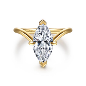 Gabriel & Co. ER16915M8Y44JJ 14 karat yellow gold Contemporary engagement ring, front view of a marquise center between wedge shaped tip prongs, with arms of the band flaring outward