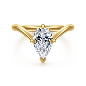 Gabriel & Co. ER16915P6Y44JJ 14 karat yellow gold Contemporary engagement ring, front view of a V shaped band rising to a pear shaped center with a pointed tip prong