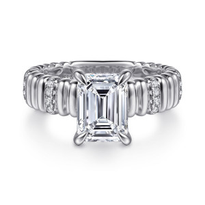 Gabriel & Co. ER16929E8W44JJ 14 karat white gold Contemporary engagement ring, front view of an emerald cut center above a wide ribbed band with short rows of small diamonds