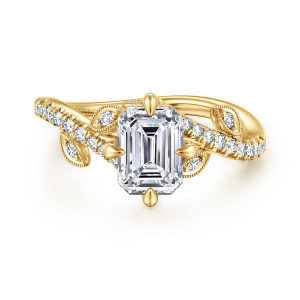 Gabriel & Co. ER16932E6Y44JJ 14 karat yellow gold Floral Nouveau engagement ring, front view of an emerald cut center with pointed prongs and beaded leaf frames near the head