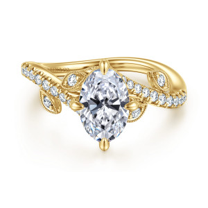 Gabriel & Co. ER16932O6Y44JJ 14 karat yellow gold Floral Nouveau engagement ring, front view of an oval center with leaf shaped frames along the crossing band