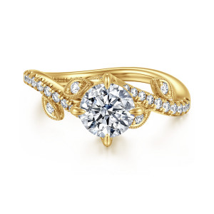 Gabriel & Co. ER16932R4Y44JJ 14 karat yellow gold Floral Nouveau engagement ring, angled view of a round center between curving band ends with leaf shaped stone panels