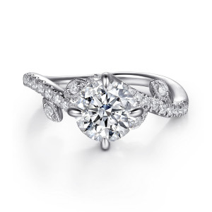 Gabriel & Co. ER16932R6W44JJ 14 karat white gold Floral Nouveau engagement ring, front view of a round center held by slender prongs, with leaf shaped frames on the crossing band