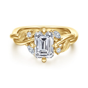 Gabriel & Co. ER16933E6Y44JJ 14 karat yellow gold Floral Nouveau engagement ring, front view of an emerald cut center held by four teardrop tipped prongs between brushed leaves