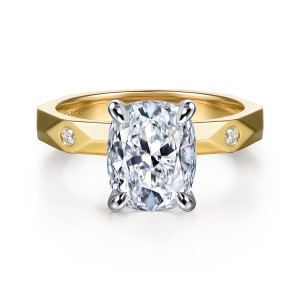 Gabriel & Co. ER16948G12M44JJ 14 karat white and yellow gold Contemporary engagement ring, front view of an elongated cushion center between small diamonds set in the faceted band