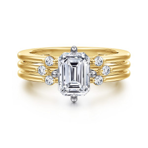 Gabriel & Co. ER16951E6M44JJ 14 karat white and yellow gold Contemporary engagement ring, front view of the emerald cut center with a diamond trio stepping across the strands on each side