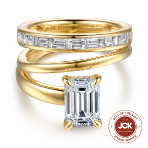 Gabriel & Co. ER16953E8Y44JJ 14 karat yellow gold Contemporary engagement ring, top view of the ring shown with a matching band of channel set baguettes above the polished wrap