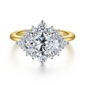 Gabriel & Co. ER16962O8M44JJ 14 karat white and yellow gold Starlight engagement ring, front view of a sideways oval center inside a starburst halo with pointed stones at each end