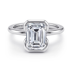 Gabriel & Co. ER16974E12W4JJJ 14 karat white gold Contemporary engagement ring, front view of an emerald cut center in a smooth frame with clipped corners above a plain band