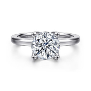Gabriel & Co. ER16976R8W44JJ 14 karat white gold Contemporary engagement ring, front view of a round center held by four rounded tip prongs on a smooth band