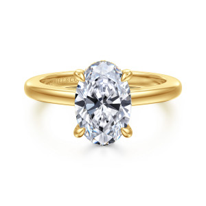 Gabriel & Co. ER16978O8Y44JJ 14 karat yellow gold Contemporary engagement ring, front view of an oval center with teardrop tipped prongs on a polished band