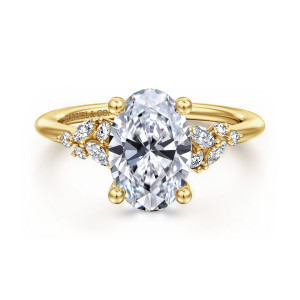 Gabriel & Co. ER16980O8Y44JJ 14 karat yellow gold Floral Nouveau engagement ring, front view of an oval center, ball tipped prongs and staggered small diamond clusters on each side