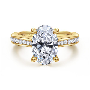 Gabriel & Co. ER16993O12Y44JJ 14 karat yellow gold Classic engagement ring, front view of an oval center gripped by four rounded prongs above channel set diamonds
