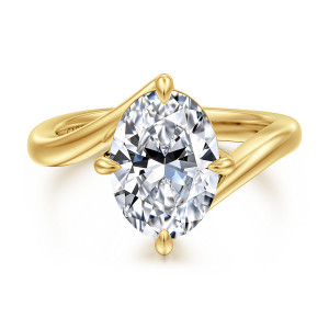 Gabriel & Co. ER16994O12Y4JJJ 14 karat yellow gold Contemporary engagement ring, front view of an oval center with tapered prong tips and the bypass ends crossing beside it