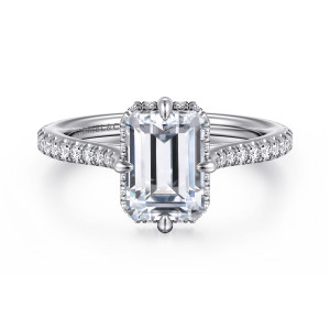 Gabriel & Co. ER16997E8W44JJ 14 karat white gold Contemporary engagement ring, front view of an emerald cut center with teardrop tipped prongs and small stones at its edge
