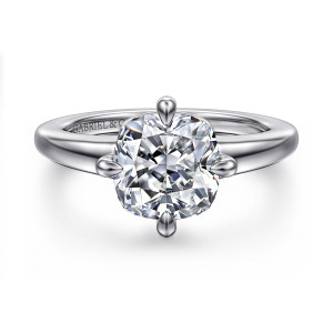 Gabriel & Co. ER16999C12W4JJJ 14 karat white gold Contemporary engagement ring, front view of a cushion cut center gripped at the middle of each side by four prongs