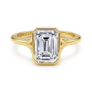 Gabriel & Co. ER17000E10Y4JJJ 14 karat yellow gold Contemporary engagement ring, front view of a smooth bezel with clipped corners around an emerald cut center