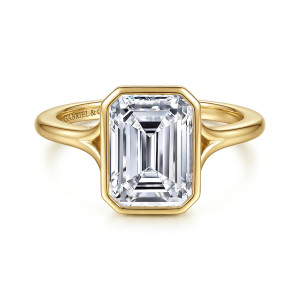 Gabriel & Co. ER17000E12Y4JJJ 14 karat yellow gold Contemporary engagement ring, front view of the clipped corner bezel around the center with the shank arms beginning to part