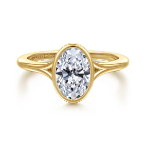 Gabriel & Co. ER17000O6Y4JJJ 14 karat yellow gold Contemporary engagement ring, front view of an oval center in a smooth bezel with the band splitting on each side