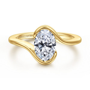 Gabriel & Co. ER17011O6Y4JJJ 14 karat yellow gold Contemporary engagement ring, front view of an oval center cradled by two ribbons that curl past each other