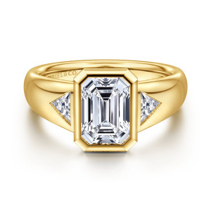 Gabriel & Co. ER17017E8Y43JJ 14 karat yellow gold Classic engagement ring, front view of an emerald cut center in a cut corner bezel between two triangular stones